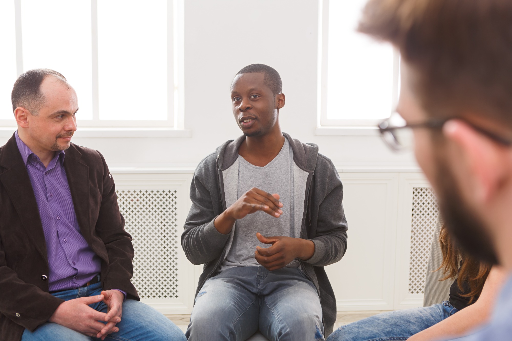Meeting of support group. African-american man talking about his life, telling his problems and issues. Mental health, psychotherapy concept